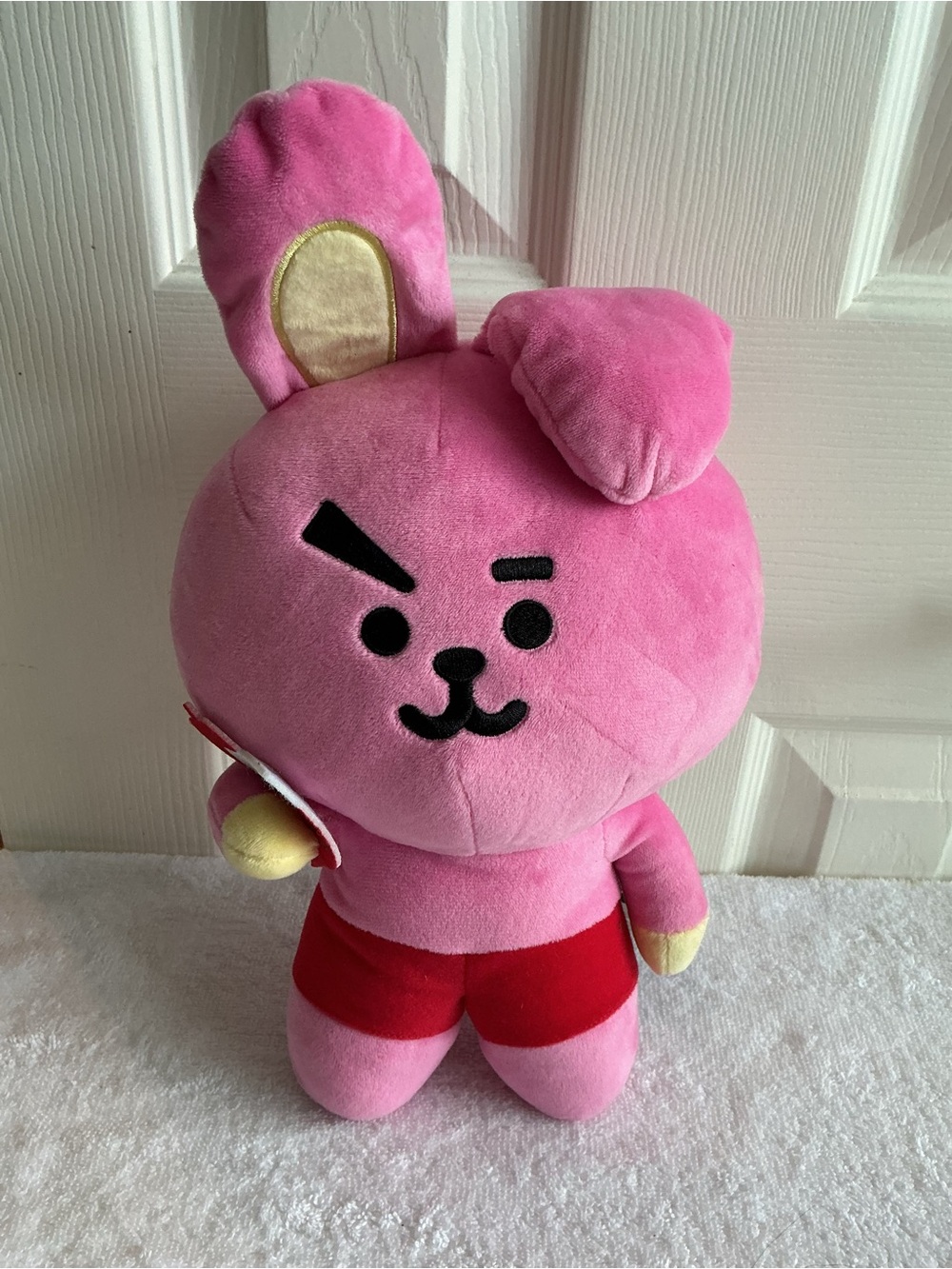 Bright Pink Plush Bunny Character Toy with Red Shorts